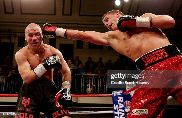 Billy Joe Saunders and Matthew Hall in action during their British and Commonwealth Middleweight Title Fight at York Hall on March 21, 2013 in...