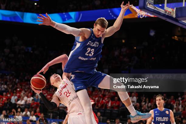 Joshua Hawkinson of Japan drives to the basket against Lauri Markkanen of Finland during the FIBA Basketball World Cup Group E game between Japan and...