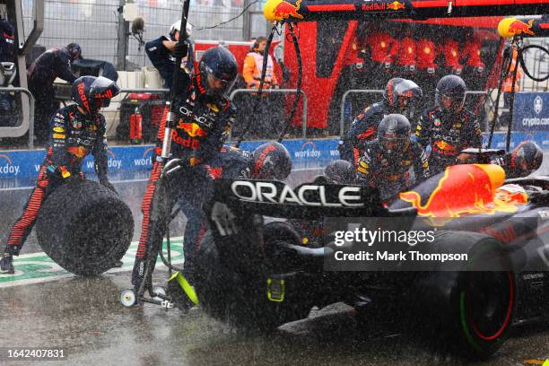 Max Verstappen of the Netherlands driving the Oracle Red Bull Racing RB19 makes a pitstop in the rain during the F1 Grand Prix of The Netherlands at...