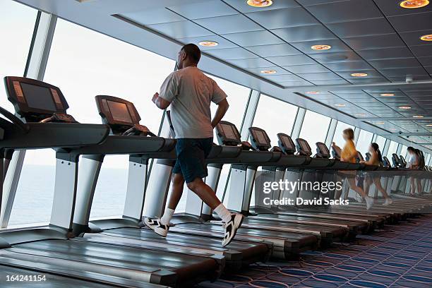 man on treadmill - cruise ship inside stock pictures, royalty-free photos & images