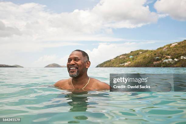 man in ocean - us virgin islands stock pictures, royalty-free photos & images