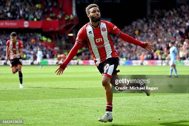 Jayden Bogle of Sheffield United celebrates after scoring their sides first goal during the Premier League match between Sheffield United and...