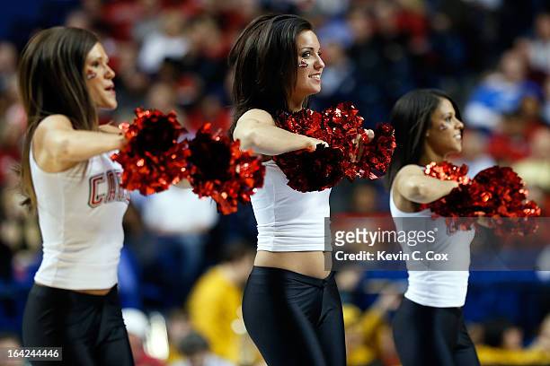 Cheerleaders for the Louisville Cardinals perform during the second round of the 2013 NCAA Men's Basketball Tournament at the Rupp Arena on March 21,...
