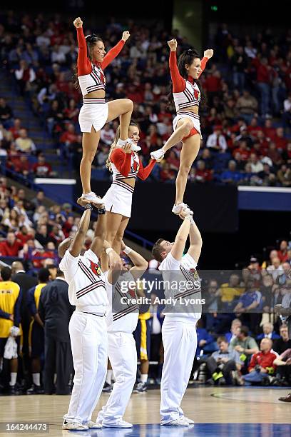 Cheerleaders for the Louisville Cardinals perform during the second round of the 2013 NCAA Men's Basketball Tournament at the Rupp Arena on March 21,...