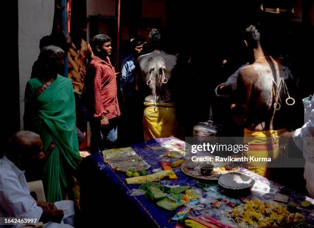 devotees getting their body pierced. - kaveripattinam stock pictures, royalty-free photos & images