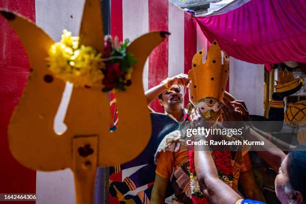 a devotee is getting accessorised with propos to look like goddess kali. - kaveripattinam stock pictures, royalty-free photos & images