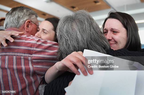 Twins Lydia, left, and Julia Parzych celebrated with their parents during match day at UMass Medical School in Worcester, Friday, March 15, 2013....