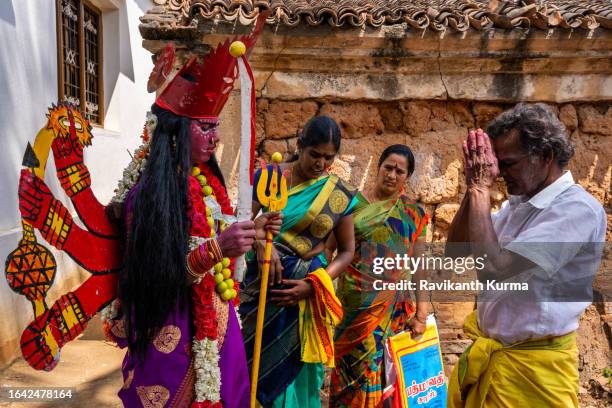 after makeover the family is offering prayers for the devotee to be possed by goddess. - kaveripattinam stock pictures, royalty-free photos & images