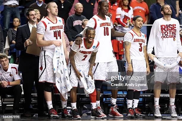 Stephan Van Treese, Russ Smith , Gorgui Dieng, Peyton Siva and Luke Hancock of the Louisville Cardinals look on from the bench towards the end of the...