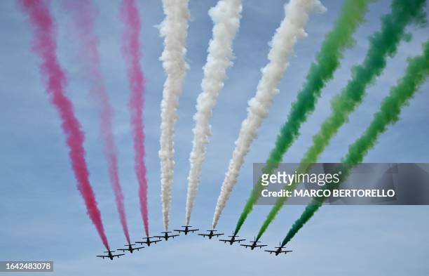 Italian air force jets fly over the Autodromo Nazionale Monza circuit leaving traces to the colours of the Italian flag prior to the start of the...