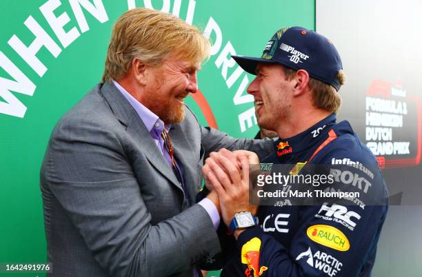 Race winner Max Verstappen of the Netherlands and Oracle Red Bull Racing celebrates with King Willem-Alexander of The Netherlands in parc ferme...