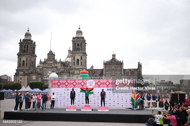 Leonard Langat of Kenya second place, Hector Garibay of Bolivia gold medal and Edwin Kiprop Kiptoo of Kenya on the podium after finishing the Men´s...