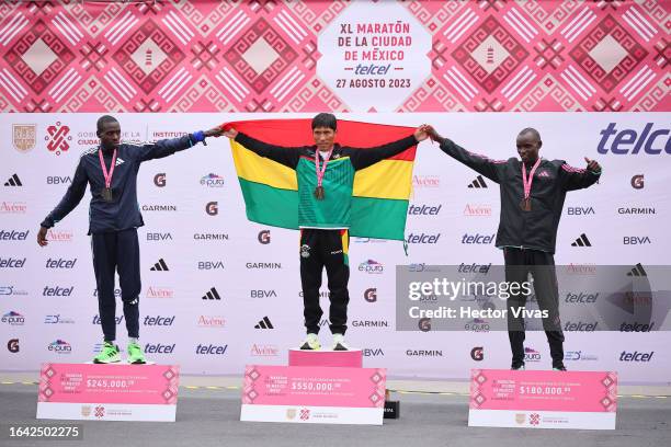 Leonard Langat of Kenya second place, Hector Garibay of Bolivia gold medal and Edwin Kiprop Kiptoo of Kenya on the podium after finishing the Men´s...