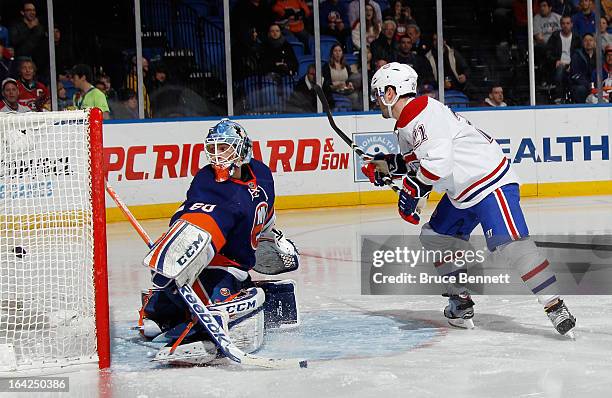 Brian Gionta of the Montreal Canadiens scores the game wining goal at 53 seconds of the third period against Kevin Poulin of the New York Islanders...