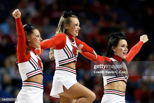 Cheerleaders for the Louisville Cardinals perform during the second round of the 2013 NCAA Men's Basketball Tournament at the Rupp Arena on March 21,...