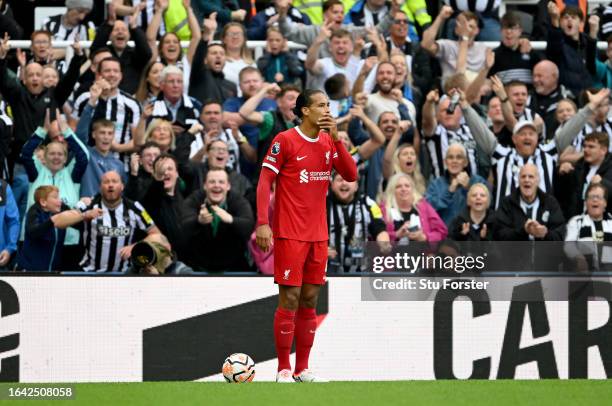 Virgil van Dijk of Liverpool reacts after being shown a red card during the Premier League match between Newcastle United and Liverpool FC at St....
