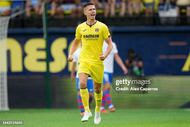 Juan Foyth of Villarreal celebrates after scoring the team's first goal during the LaLiga EA Sports match between Villarreal CF and FC Barcelona at...