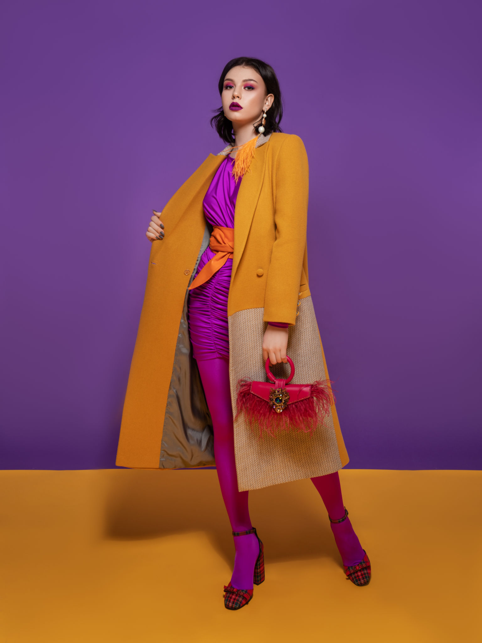 Fashion model on yellow and purple studio background Fashion model on yellow and purple studio background