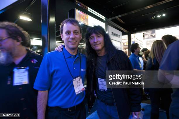 American singer Joey Belladonna of the band Anthrax poses with Shure Incorporated employee Gino Sigismondi at the NAMM Trade Show at the Anaheim...