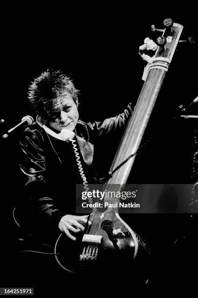 American musician Laurie Anderson play tanpura and a corded telephone on stage at Park West, Chicago, Illinois, March 23, 1983.