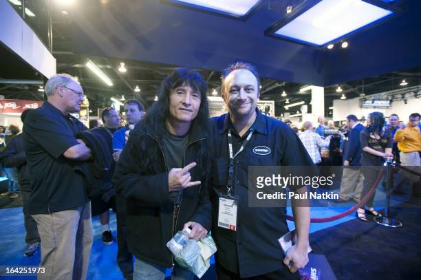 American singer Joey Belladonna of the band Anthrax poses with Shure Incorporated employee Ryan Smith at the NAMM Trade Show at the Anaheim...