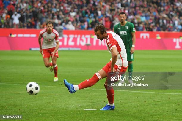 Harry Kane of Bayern Munich scores the team's second goal from the penalty-spot during the Bundesliga match between FC Bayern München and FC Augsburg...