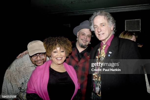 Form left, portrait of American musician Tim Austin, Mavis Staples, Nick Tremulis, and David Amram as they pose backstage together, Chicago,...