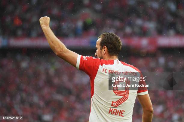Harry Kane of Bayern Munich celebrates after scoring the team's second goal from the penalty-spot during the Bundesliga match between FC Bayern...
