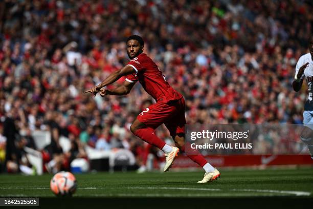 Liverpool's English defender Joe Gomez gestures during the English Premier League football match between Liverpool and Aston Villa at Anfield in...