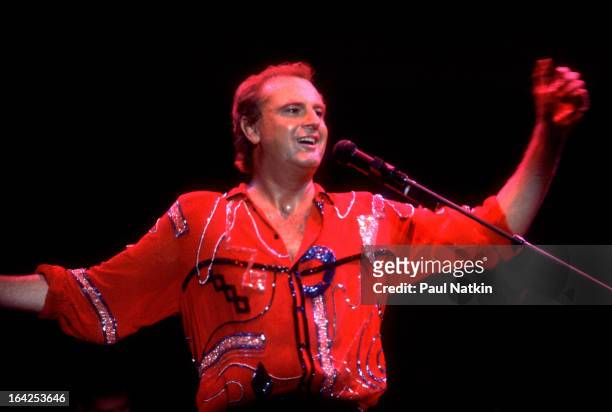 Australian musician Peter Allen performs on stage at Park West, Chicago, Illinois, early 1980s.