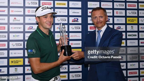 Todd Clements of England poses with Petr Dedek, Owner of DD Group after winning the D+D Real Czech Masters at Albatross Golf Resort on August 27,...