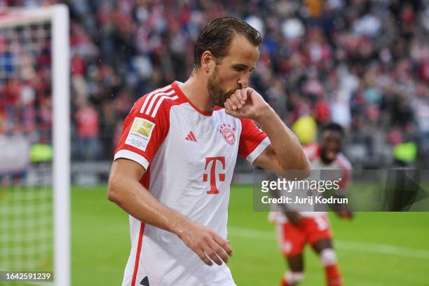 Harry Kane of Bayern Munich celebrates after scoring the team's third goal during the Bundesliga match between FC Bayern München and FC Augsburg at...