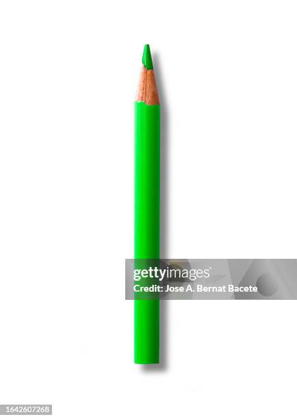 green wooden pencil for drawing on a white canvas. - colored pencil stock pictures, royalty-free photos & images