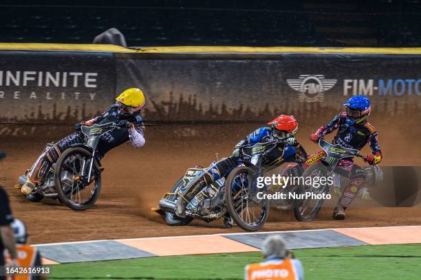 Jack Holder inside Kim Nilsson with Max Fricke behind as Jason Doyle falls at the back during the FIM Speedway Grand Prix of Great Britain at the...