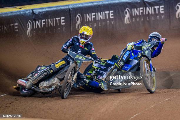 Maciej Janowski goes wide with Jason Doyle behind during the FIM Speedway Grand Prix of Great Britain at the Principality Stadium, Cardiff on...