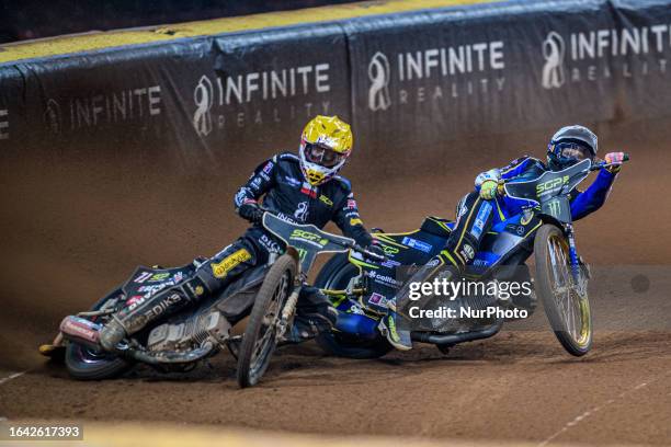 Maciej Janowski goes wide with Jason Doyle behind during the FIM Speedway Grand Prix of Great Britain at the Principality Stadium, Cardiff on...