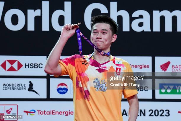 Kunlavut Vitidsarn of Thailand poses with his medal on the podium after the Men's Singles Final match against Kodai Naraoka of Japan on day seven of...
