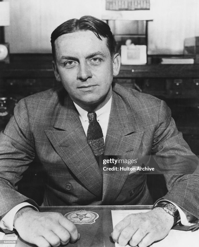 FBI Agent Eliot Ness Seated At Desk, c. 1930.