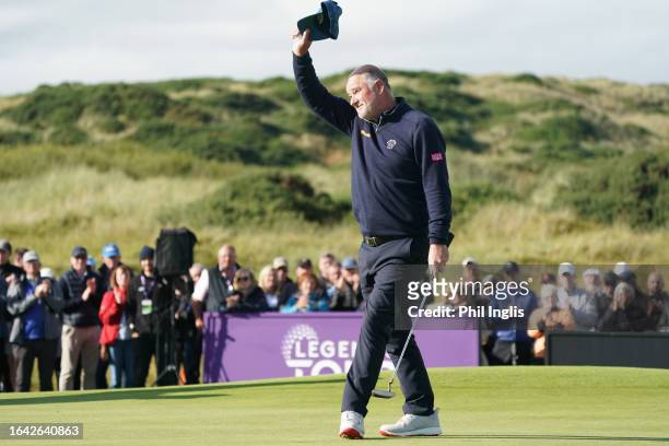 Peter Baker of England acknowledges the crowds applause on the 18th green during Day Four of the Staysure Seniors PGA Championship at Trump...