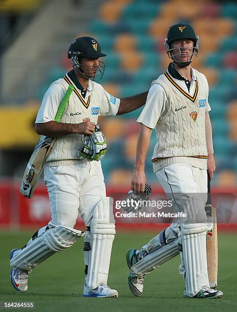 Ricky Ponting and Jordan Silk of the Tigers leave the field at the end of play on day one of the Sheffield Shield final between the Tasmania Tigers...
