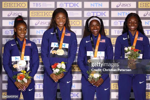Gold medalists Sha'Carri Richardson, Gabrielle Thomas, Twanisha Terry and Tamari Davis of Team United States pose for a photo on the podium during...