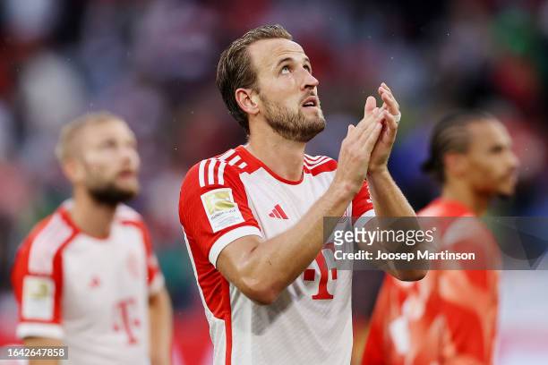 Harry Kane of Bayern Munich applauds the fans at full-time following the Bundesliga match between FC Bayern München and FC Augsburg at Allianz Arena...