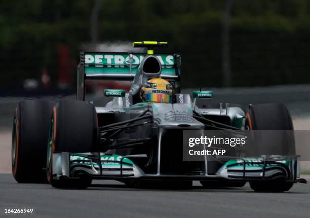 Mercedes driver Lewis Hamilton of Britain steers his car during the second practice session ahead of the Formula One Malaysian Grand Prix at Sepang...