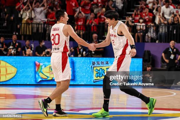 Keisei Tominaga of Japan celebrates a basket with Yuta Watanabe of Japan during the FIBA Basketball World Cup Group E game between Japan and Finland...