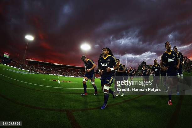 Ma'a Nonu and Hosea Gear of the Highlanders lead the team off prior to the round six Super Rugby match between the Chiefs and the Highlanders at...