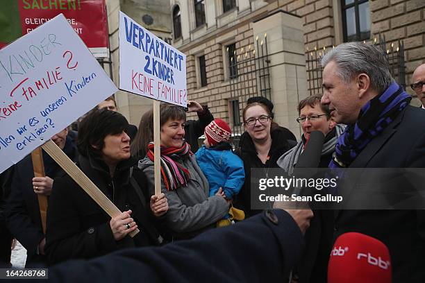 Berlin Mayor Klaus Wowereit speaks with Gabriele and Susanna Herwig, who are lesbian, in a legal partnership, and have two children, and were joining...