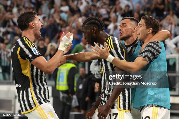 Dusan Vlahovic of Juventus celebrates with team mates after scoring to level the game at 1-1 during the Serie A TIM match between Juventus and...