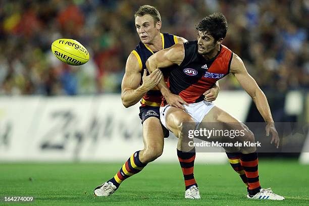 Brent Reilly of the Crows competes with David Myers of the Bombers during the round one AFL match between the Adelaide Crows and the Essendon Bombers...