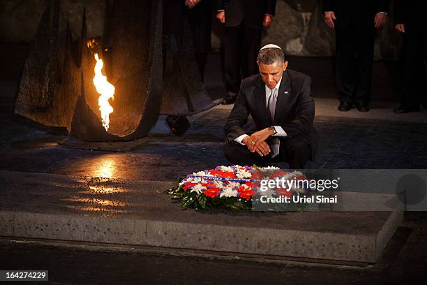 President Barack Obama pays his respects in the Hall of Remembrance in front of Israel's President Shimon Peres, Israel's Prime Minster Benjamin...