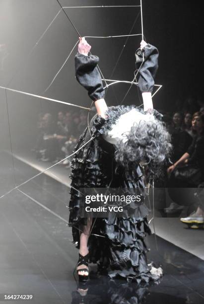 Model showcases designs on the runway at the Alice Auaa show during Mercedes Benz Fashion Week Tokyo Autumn/Winter 2013/14 at Shibuya Hikarie Hikari...